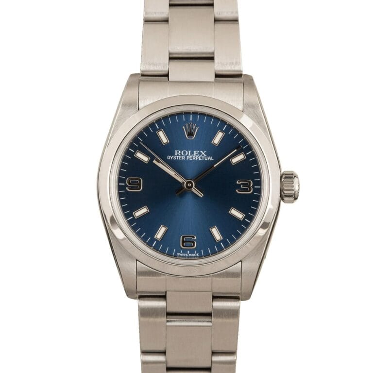 Silver Rolex Datejust 77080 wristwatch with a blue dial, silver hour markers, and a metal link bracelet, shown on a white background.
