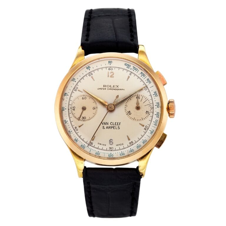 Gold Rolex chronograph watch with black leather strap, two subdials, and Van Cleef & Arpels on the face.