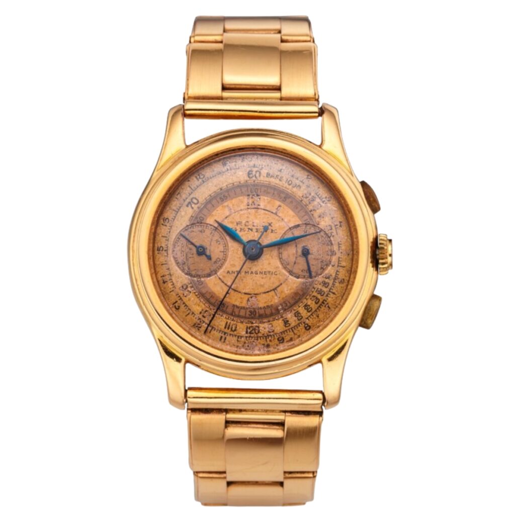 A vintage gold Rolex Chronograph wristwatch featuring a worn, brownish dial and a classic metal link band.