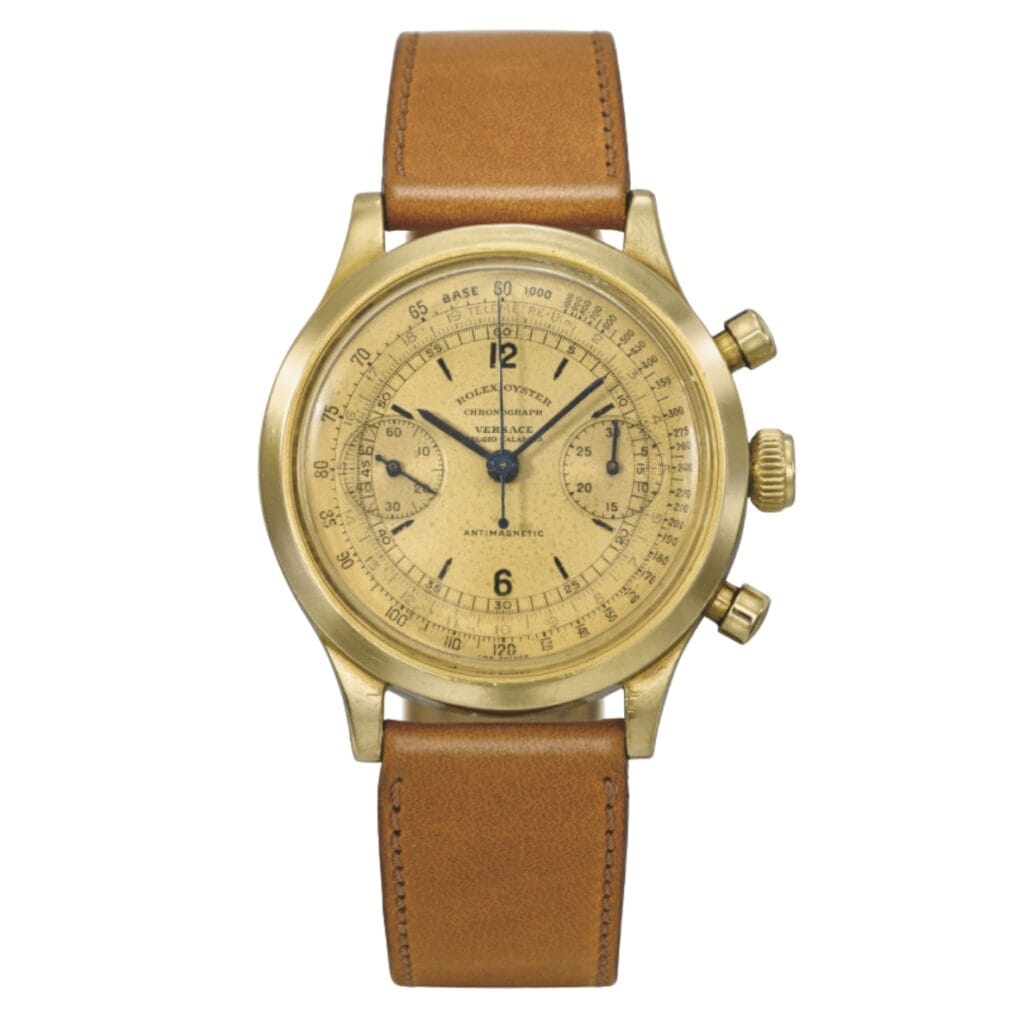 A vintage gold Rolex Chronograph 3525 wristwatch with a tan leather strap and detailed dial markings.