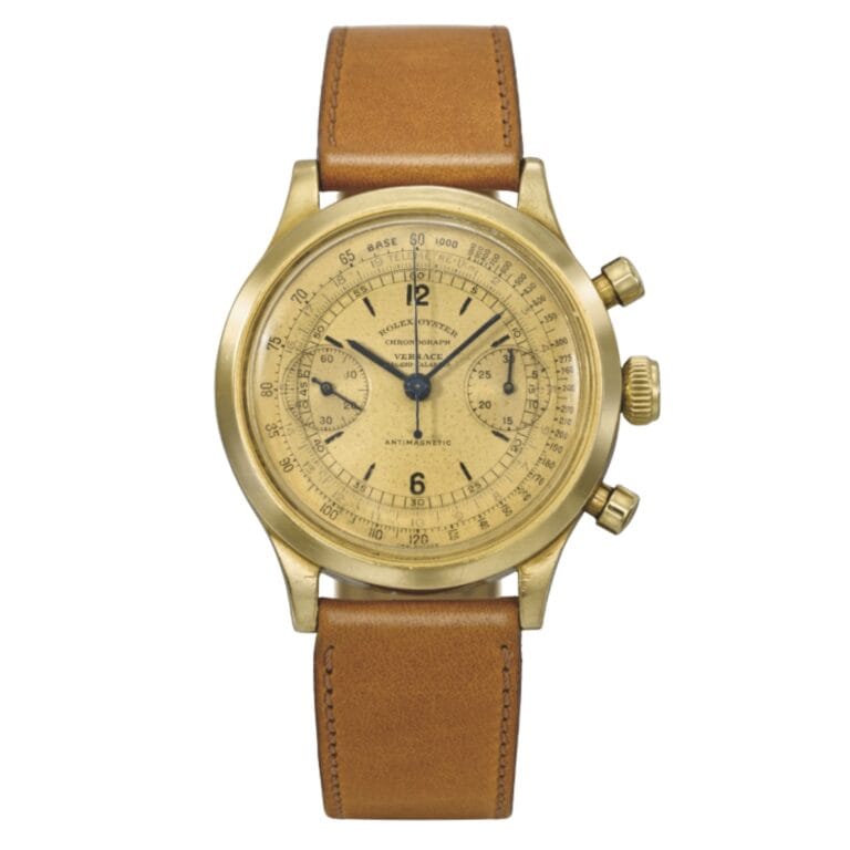 A vintage gold Rolex Chronograph 3525 wristwatch with a tan leather strap and detailed dial markings.
