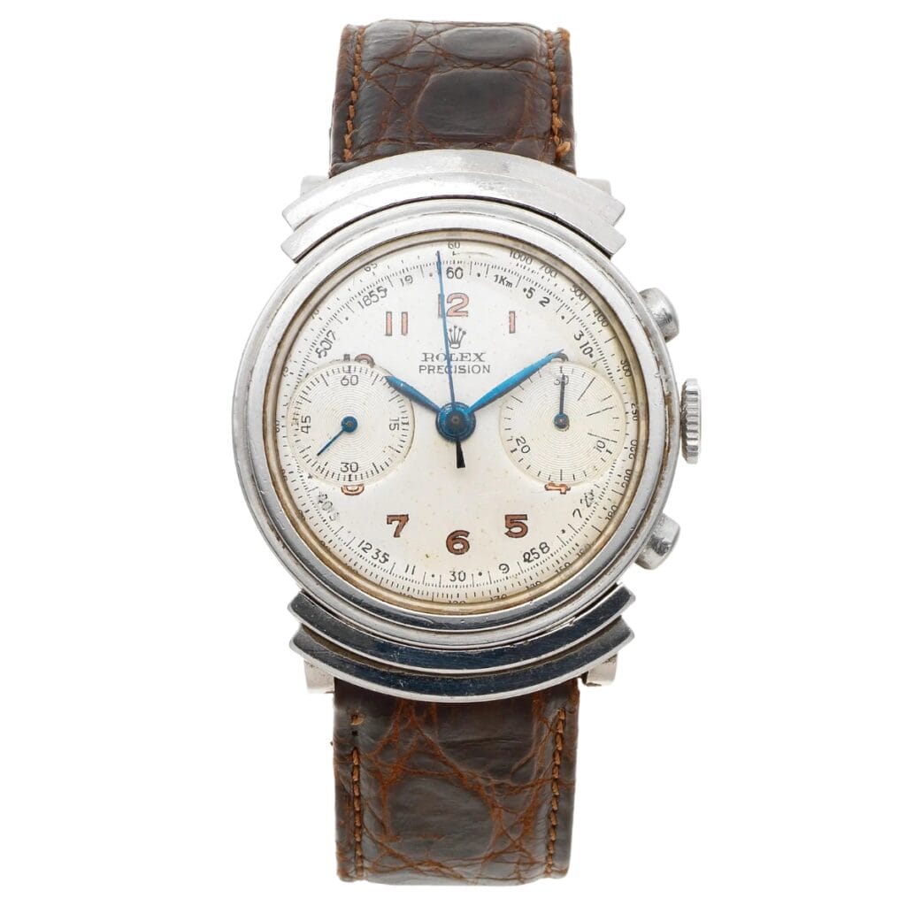 Vintage Rolex Chronograph 2917 watch with a white dial, chronograph subdials, and a classic brown leather strap.