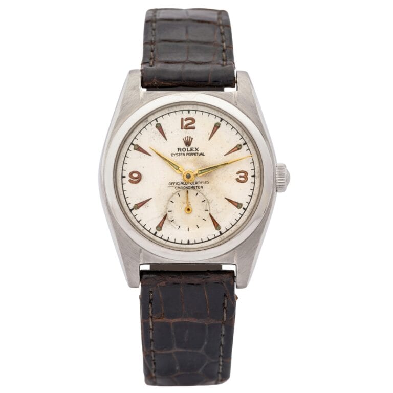 Vintage Rolex Oyster Perpetual 6052 watch with a white dial and brown leather strap, shown from the front.
