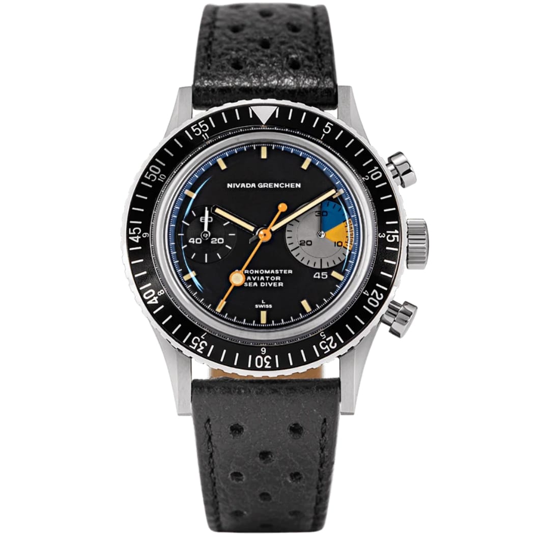 A Nivada Grenchen Chronomaster Aviator Sea Diver wristwatch with a black strap, black dial, and colorful subdials, showing 10:08.
