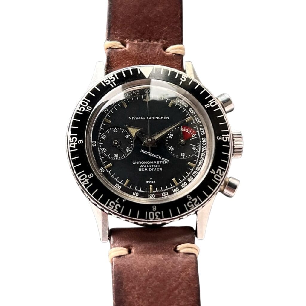 A Nivada Grenchen Chronomaster Aviator Sea Diver 105/9855 watch with a black dial and brown leather strap.