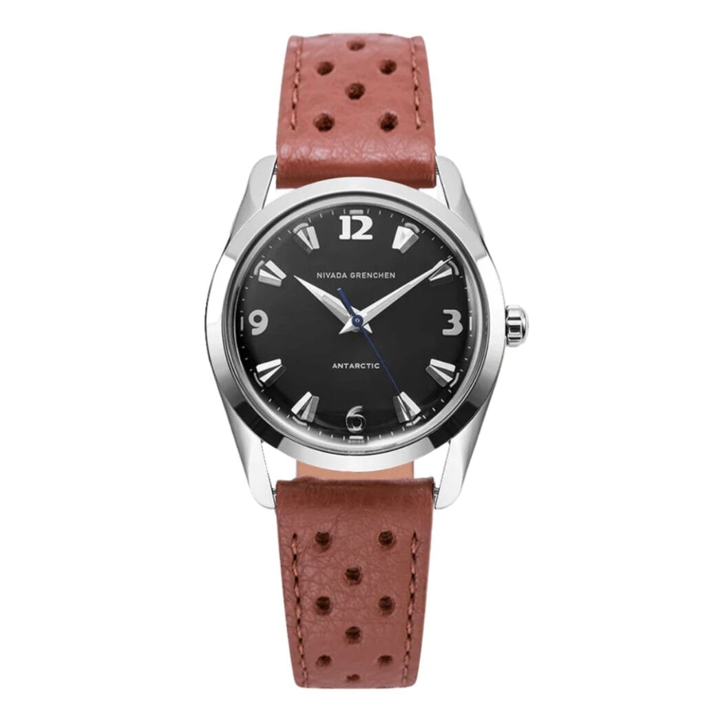 A wristwatch with a black dial, silver markers, and a brown perforated leather strap, inspired by the Nivada Grenchen Antarctic 35002M41.
