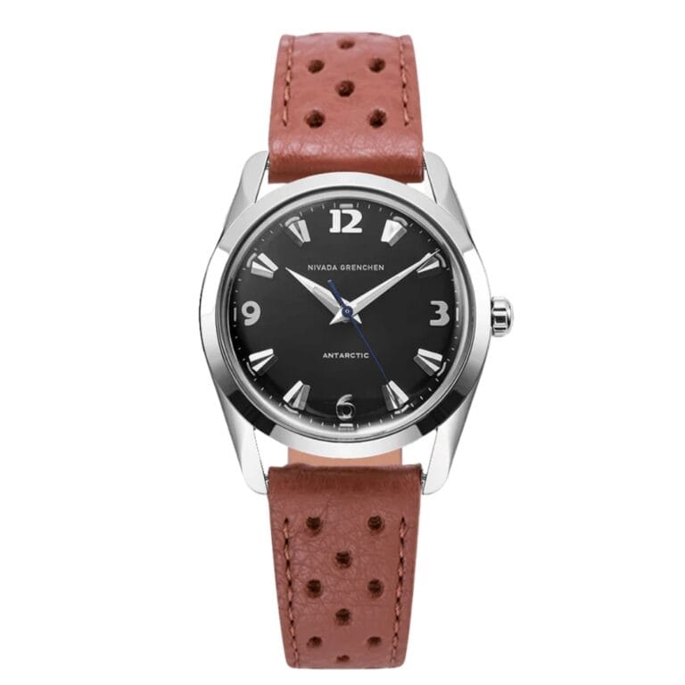 A wristwatch with a black dial, silver markers, and a brown perforated leather strap, inspired by the Nivada Grenchen Antarctic 35002M41.