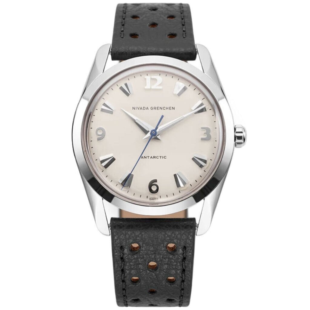 A silver Nivada Grenchen Antarctic 35004M40 wristwatch with a beige dial and black perforated leather strap.
