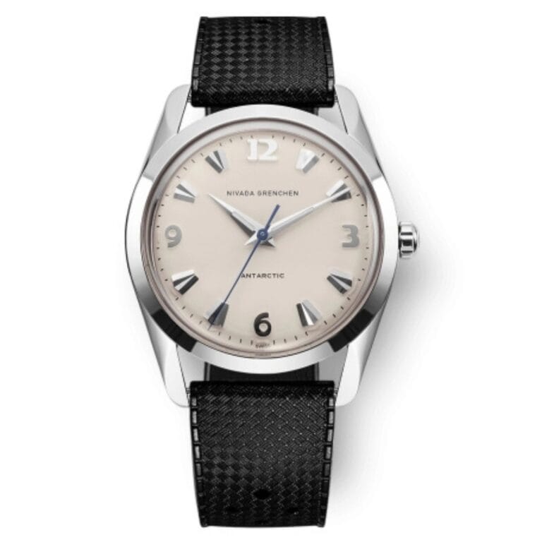 Silver wristwatch with a beige dial, black numerals, and a textured black leather strap—this 35004M01 Antarctic model by Nivada Grenchen combines classic elegance with timeless design.
