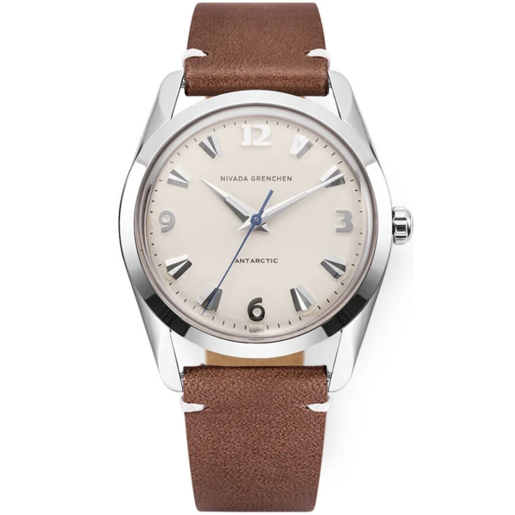 A silver wristwatch inspired by the iconic Nivada Grenchen Antarctic, featuring a beige dial, brown leather strap, and silver hour markers and hands. Model: 35004M14.