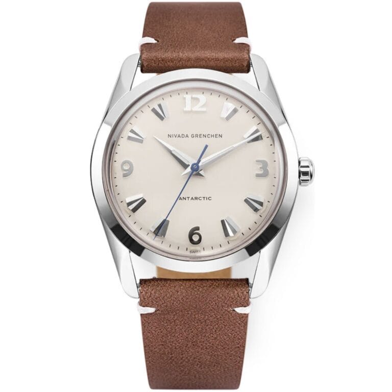 A silver wristwatch inspired by the iconic Nivada Grenchen Antarctic, featuring a beige dial, brown leather strap, and silver hour markers and hands. Model: 35004M14.