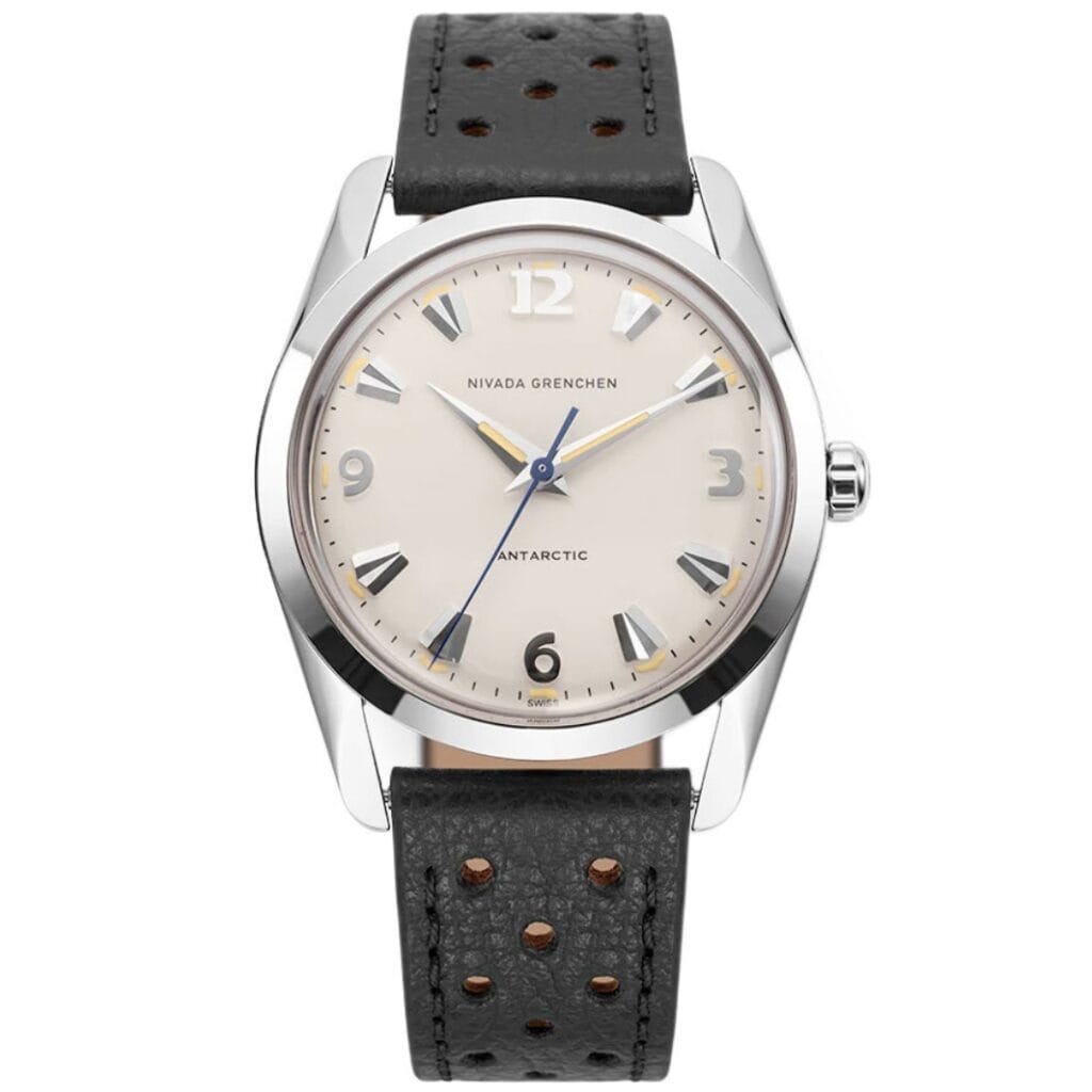 A silver Nivada Grenchen Antarctic 35001M40 wristwatch with a cream dial and black perforated leather strap.