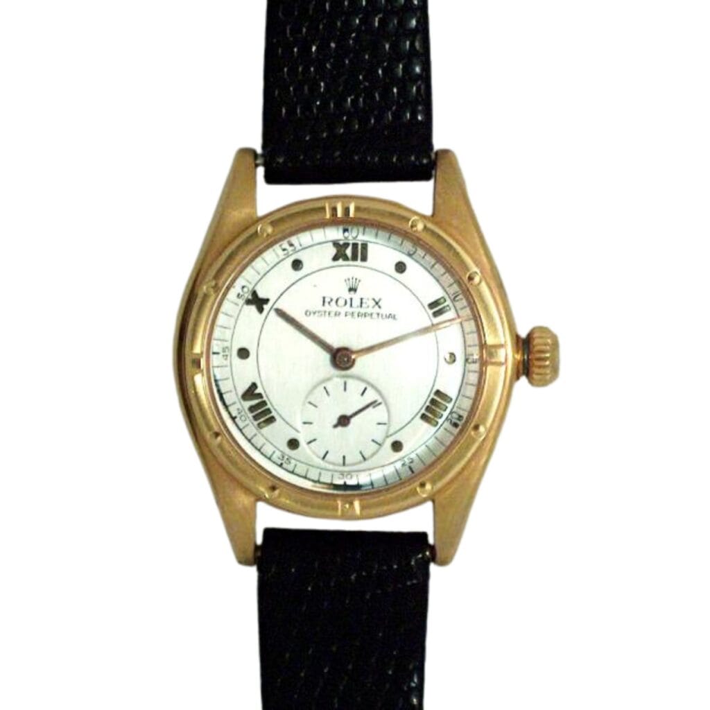 Rolex Oyster Perpetual wristwatch, model 3795, featuring a gold case, black leather strap, and elegant white dial.
