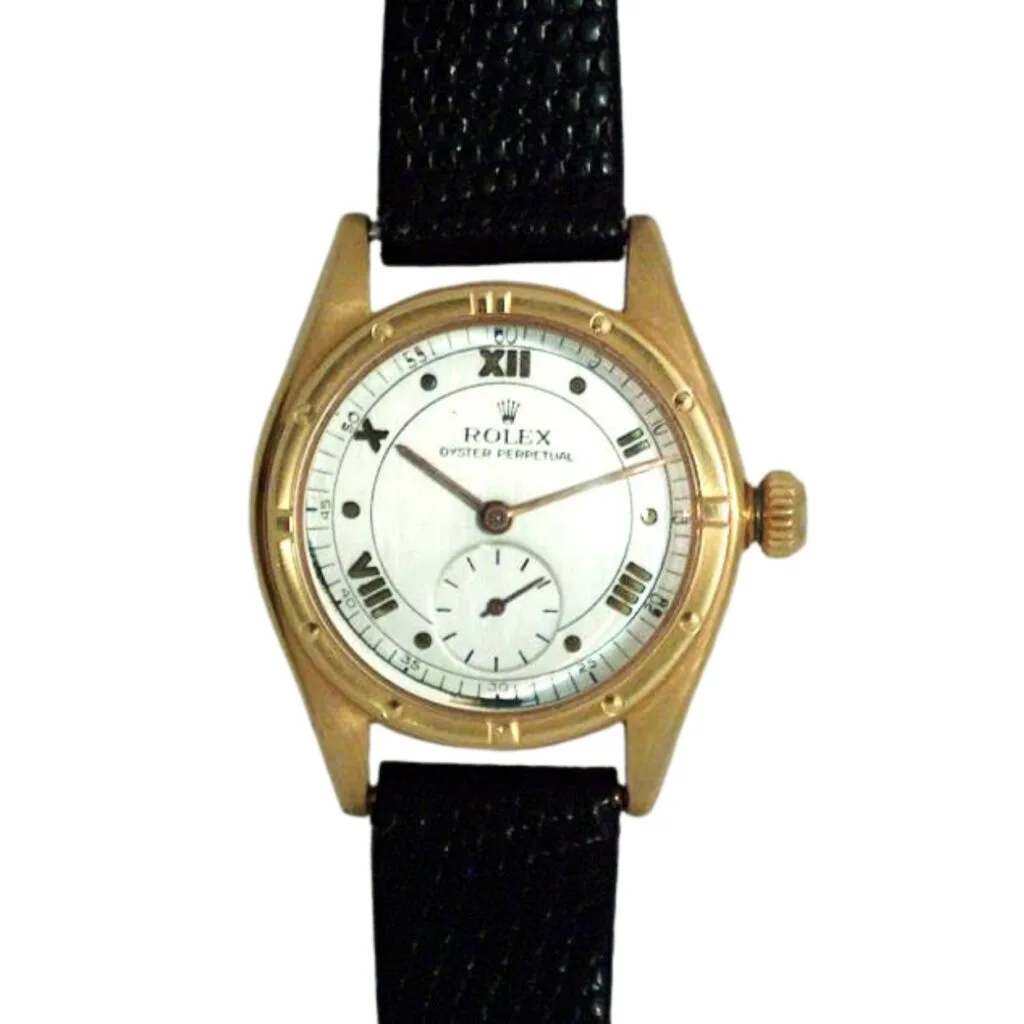 Rolex Oyster Perpetual wristwatch, model 3795, featuring a gold case, black leather strap, and elegant white dial.