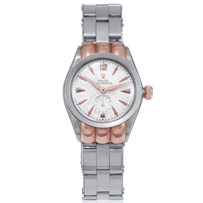 A silver and rose gold Rolex Oyster Perpetual wristwatch, model 3353, with a white face and a sleek metal bracelet.