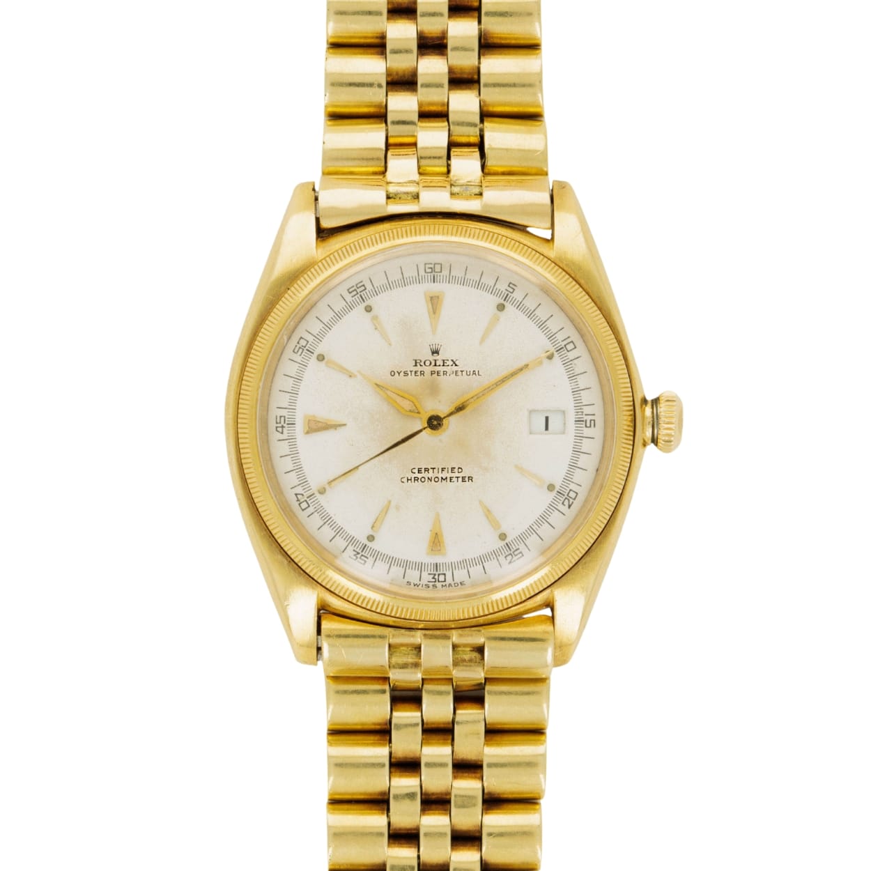 Gold Rolex Datejust 4467 wristwatch with a white dial, date window, and linked gold bracelet, viewed from above.
