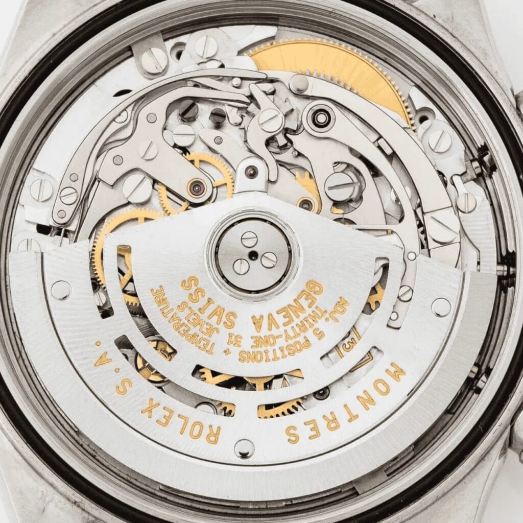 Close-up of a Rolex watch movement, showing intricate gears and ROLEX S.A. GENEVA SWISS engraved in gold.
