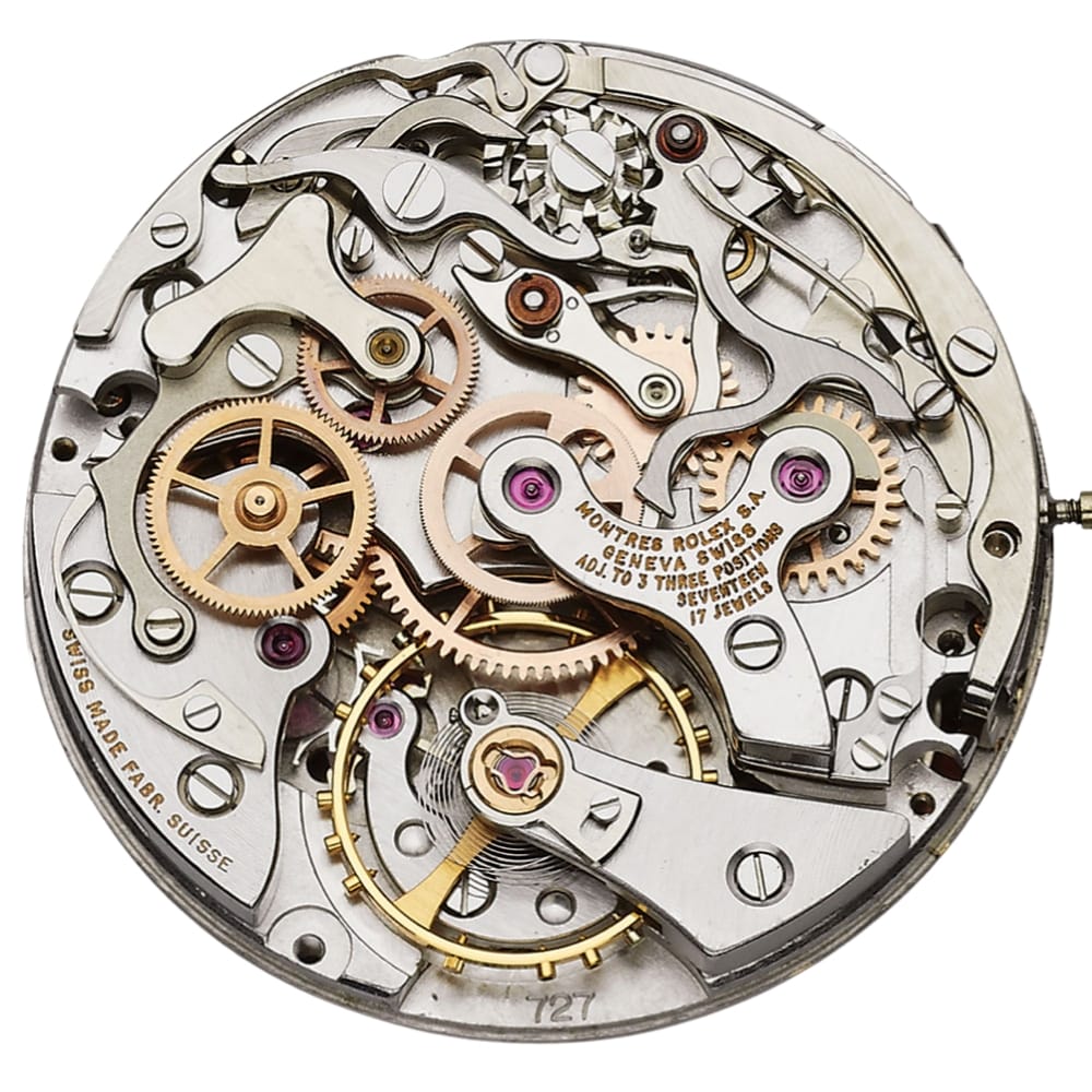 Close-up of a mechanical watch movement showing gears, levers, and intricate metal components.