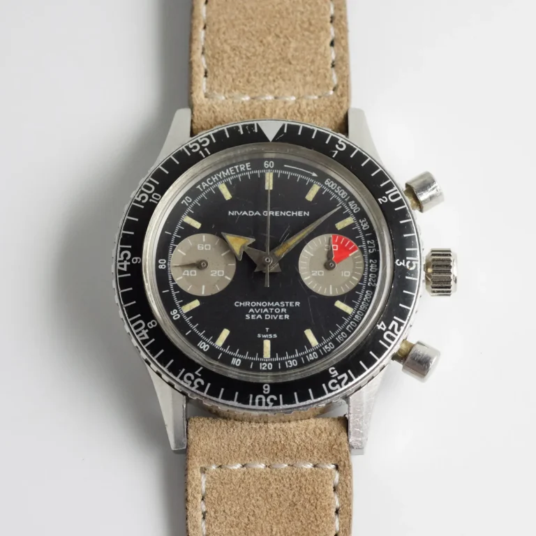 A vintage Nivada Grenchen Chronomaster Aviator Sea Diver chronograph wristwatch with a tan leather strap on a white background.