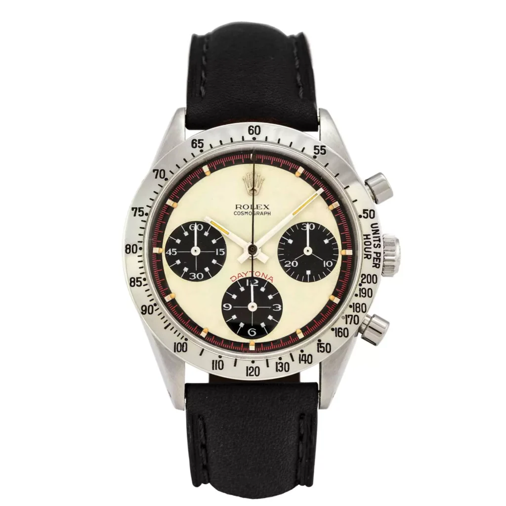 The Rolex Cosmograph Daytona 6239 features a black leather strap and three black subdials on a striking white face.