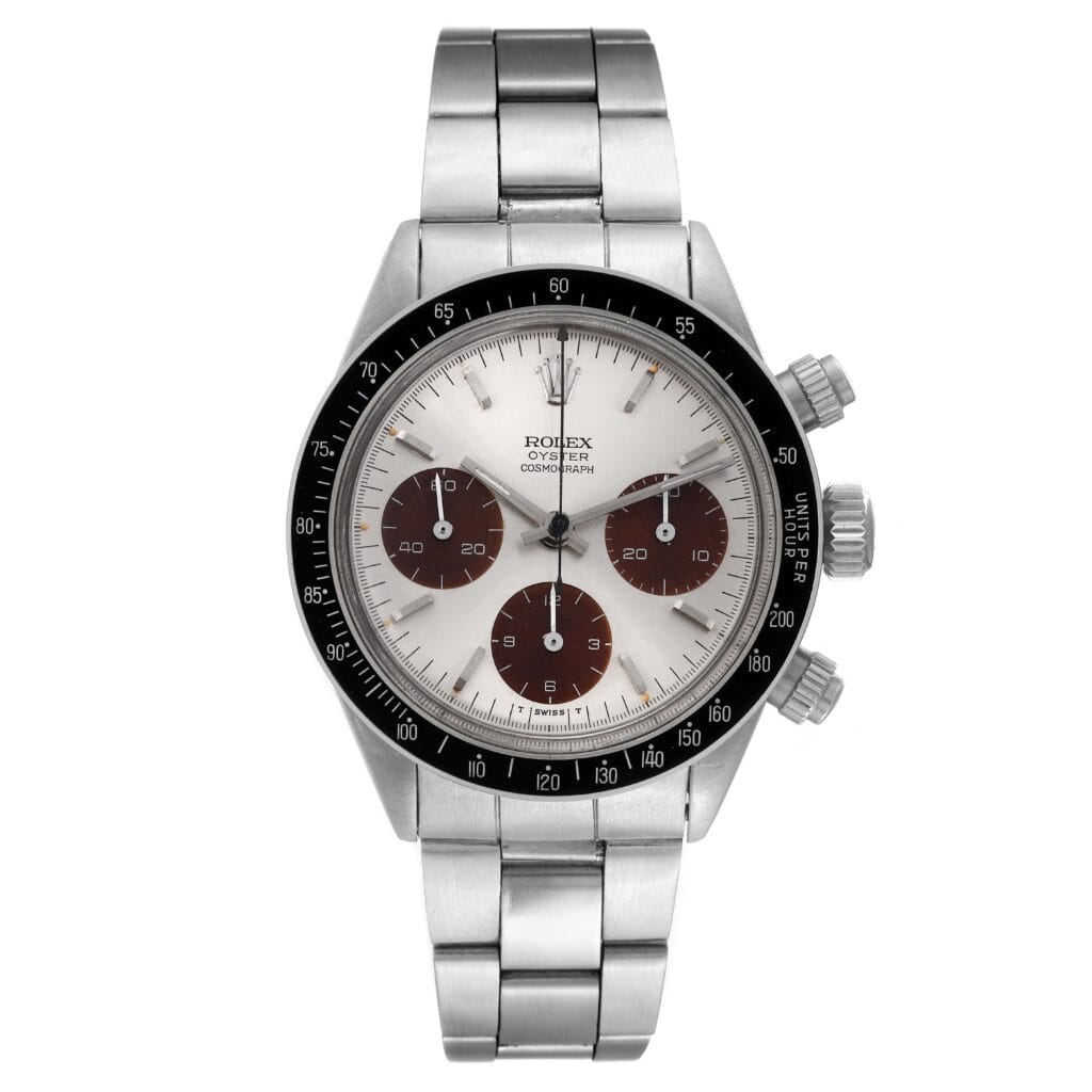 A stainless steel Rolex Cosmograph Daytona 6240 watch with a white dial and three brown subdials.