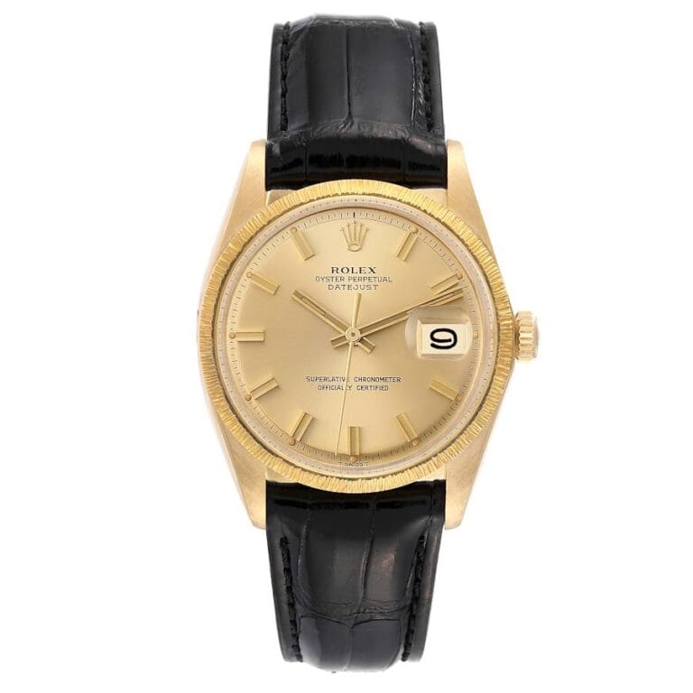 Gold Rolex Datejust 1607 watch featuring a black leather strap and a date window at 3 o’clock.