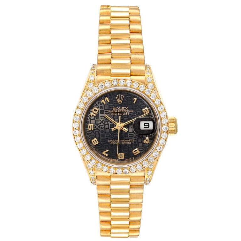 Gold Rolex Datejust 69038 watch with diamond bezel, black dial, and gold Arabic numerals, displaying the date.