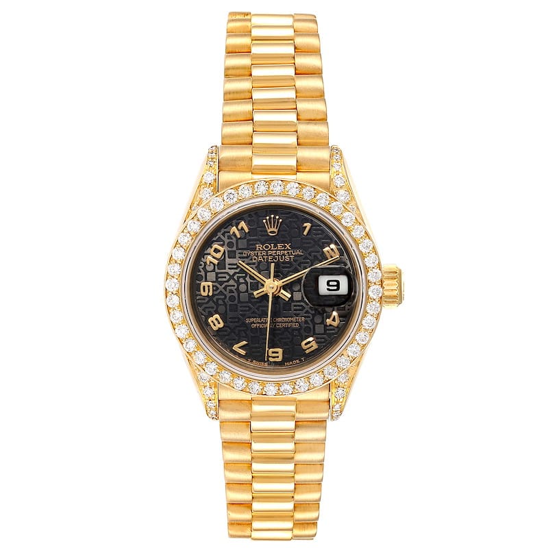 Gold Rolex Datejust 69038 watch with diamond bezel, black dial, and gold Arabic numerals, displaying the date.
