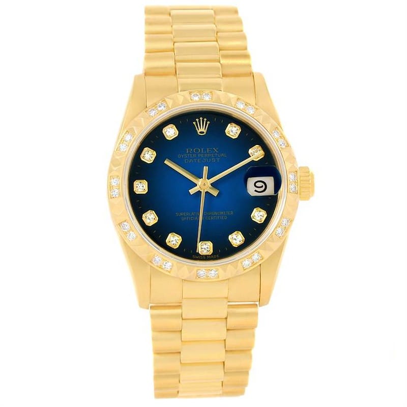 Gold Rolex Datejust 68258 watch featuring a blue dial, diamond hour markers, and a date window at the 3 o’clock position.
