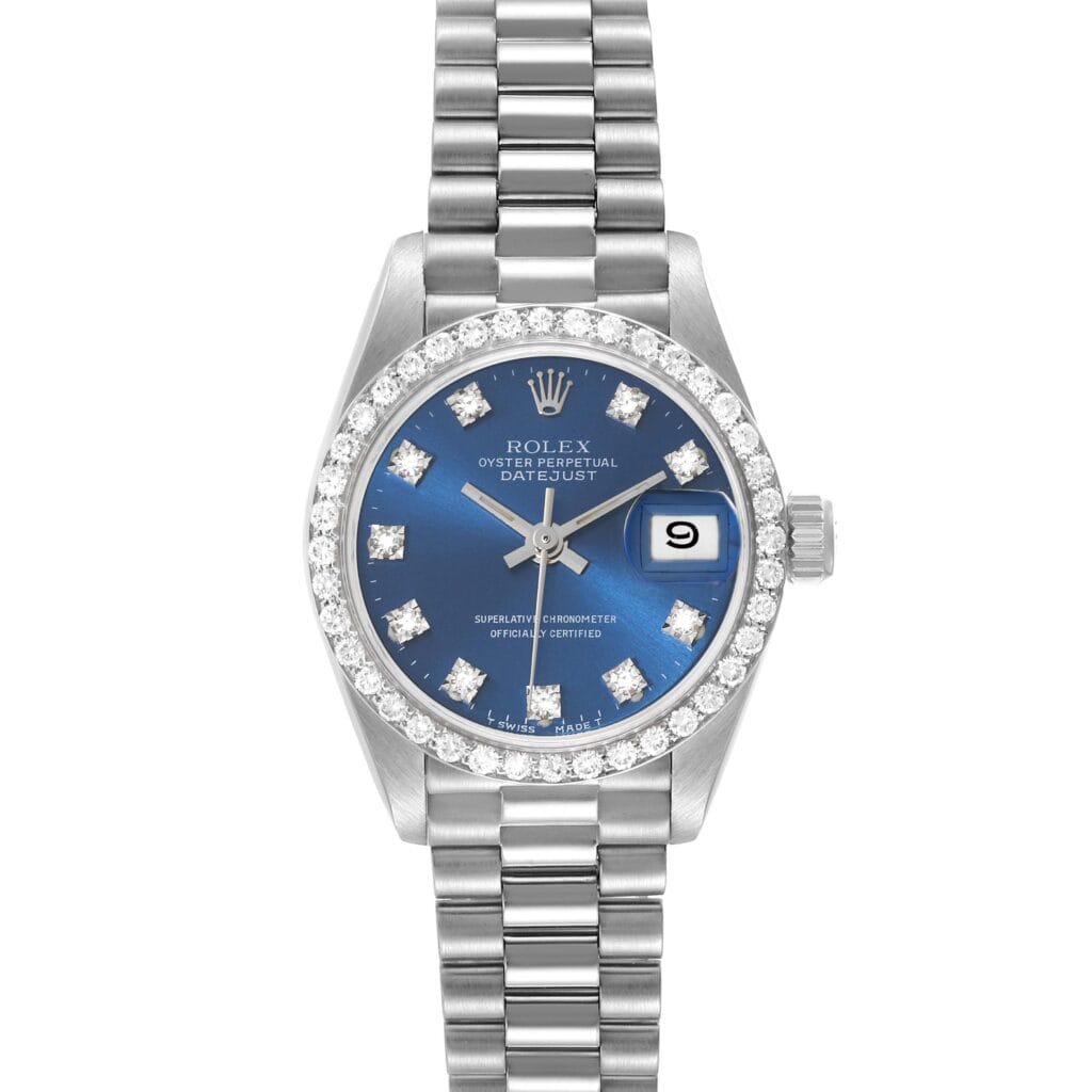 A Rolex Datejust 69139 watch with a blue dial, diamond hour markers, and a silver metal bracelet.