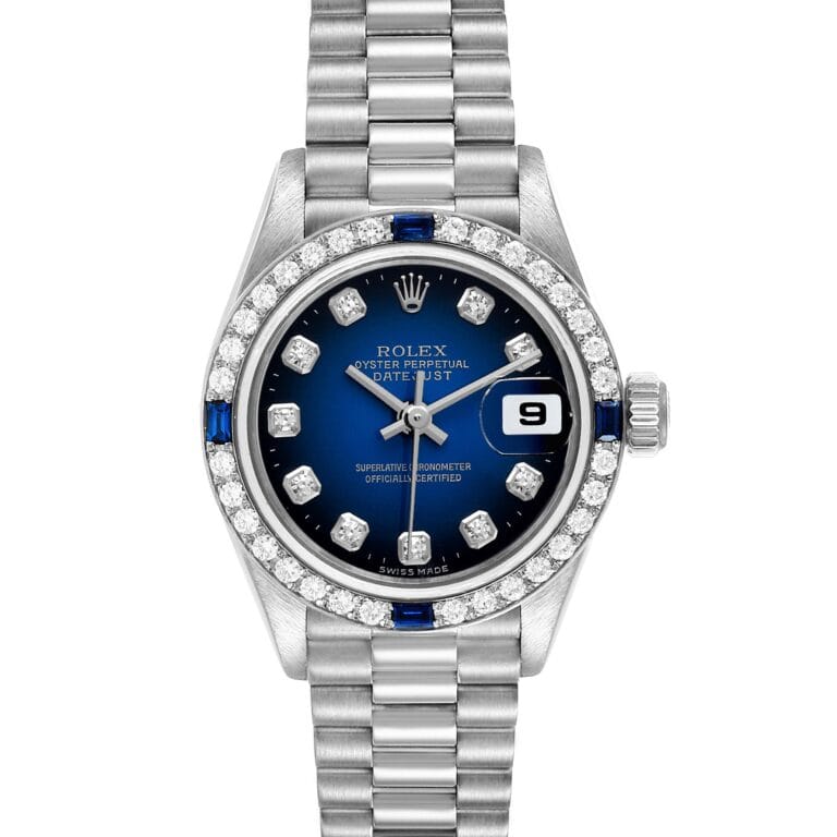 Silver Rolex Datejust watch, model 79089, with a blue face, diamonds around the bezel, and a silver metal link band, featuring a date display.