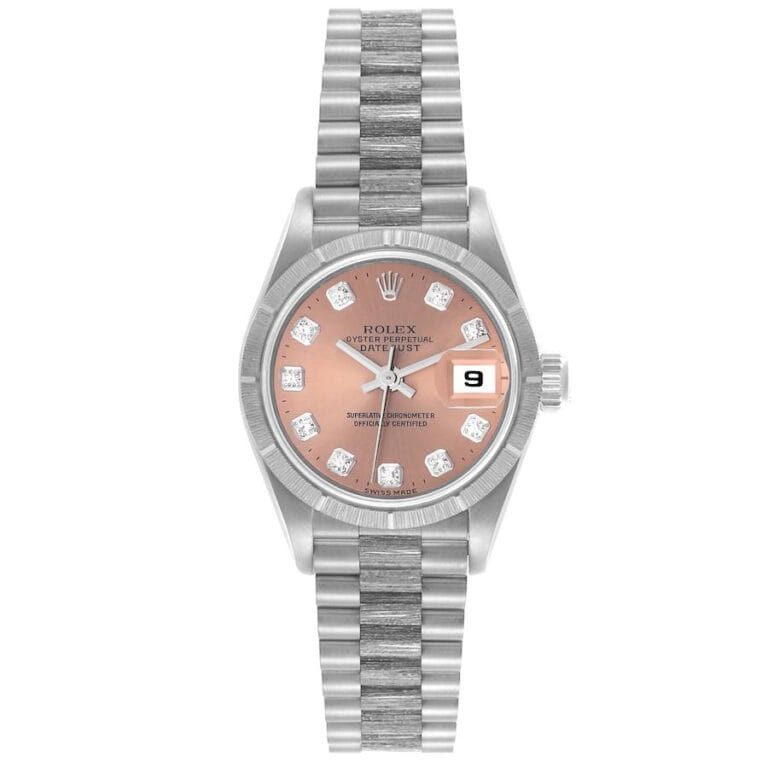 Silver Rolex Datejust watch, model 69279, features a pink dial, diamond hour markers, and a date display at 3 o’clock.