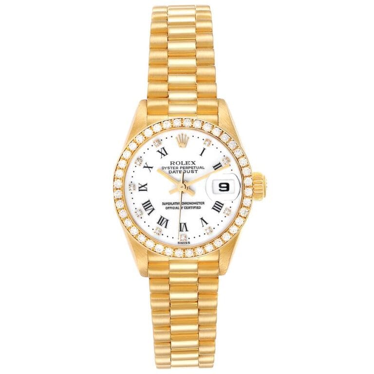 Gold Rolex Datejust 79138 wristwatch with a white dial, Roman numerals, diamond bezel, and date display at 3 o’clock.