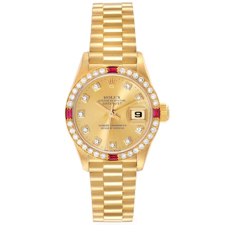 Gold Rolex Datejust 79068 watch with diamond and ruby accents, featuring a date window and a linked bracelet.