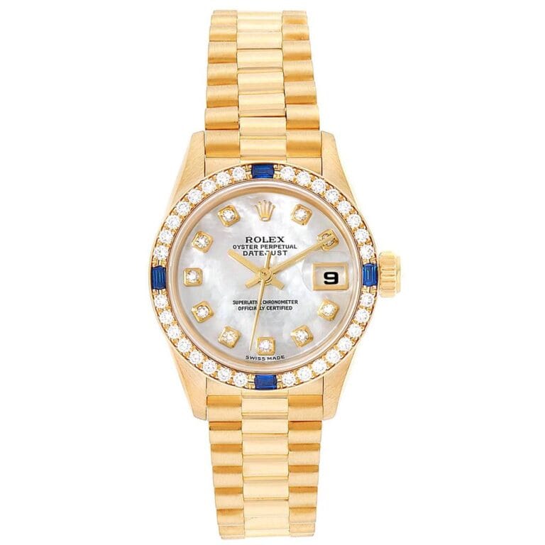 Gold Rolex Datejust 79088 watch with diamond and blue accents, a date window, and a silver dial on a gold link bracelet.
