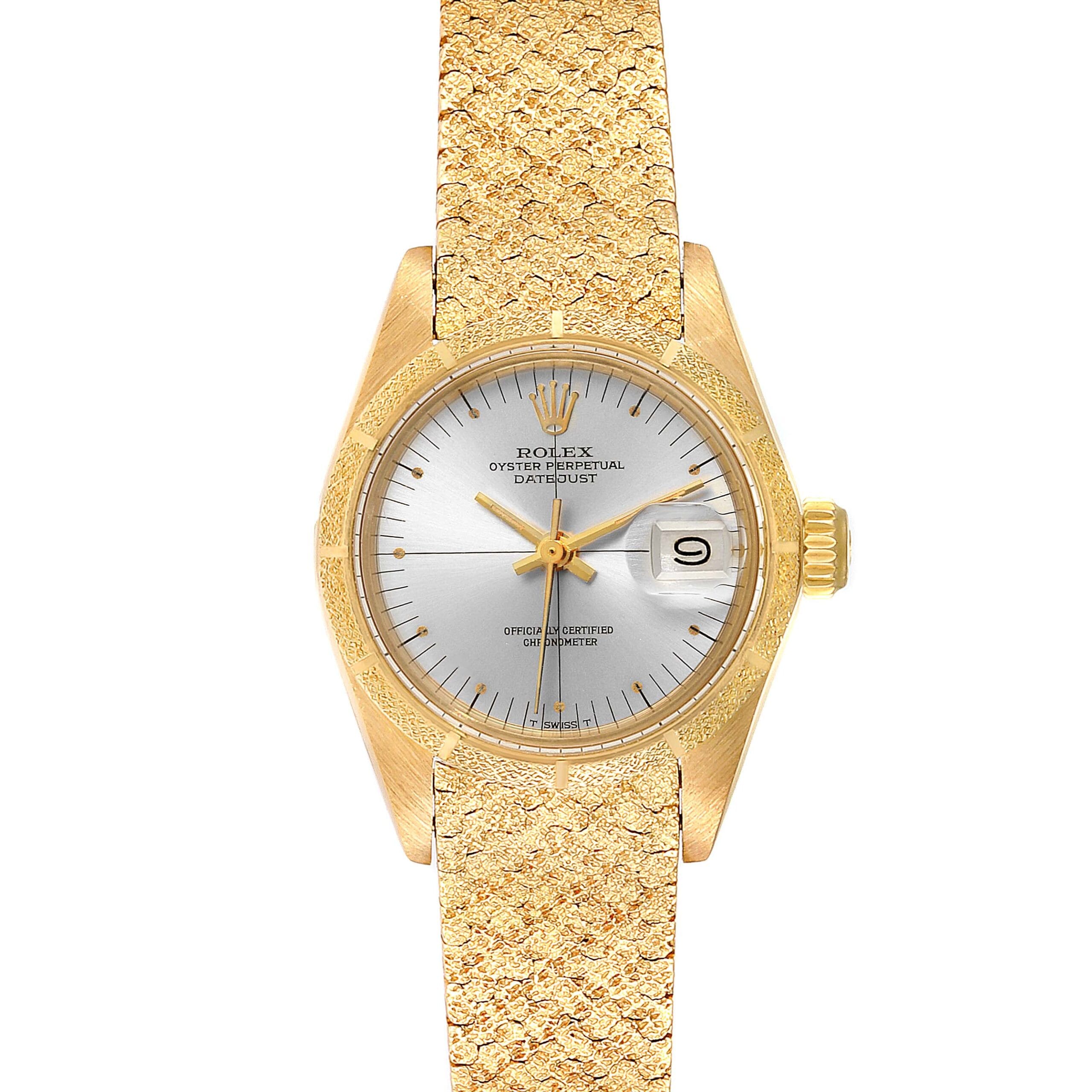 Gold Rolex Datejust 6900 watch with a silver dial and textured gold bracelet, displaying the date at 3 o’clock.
