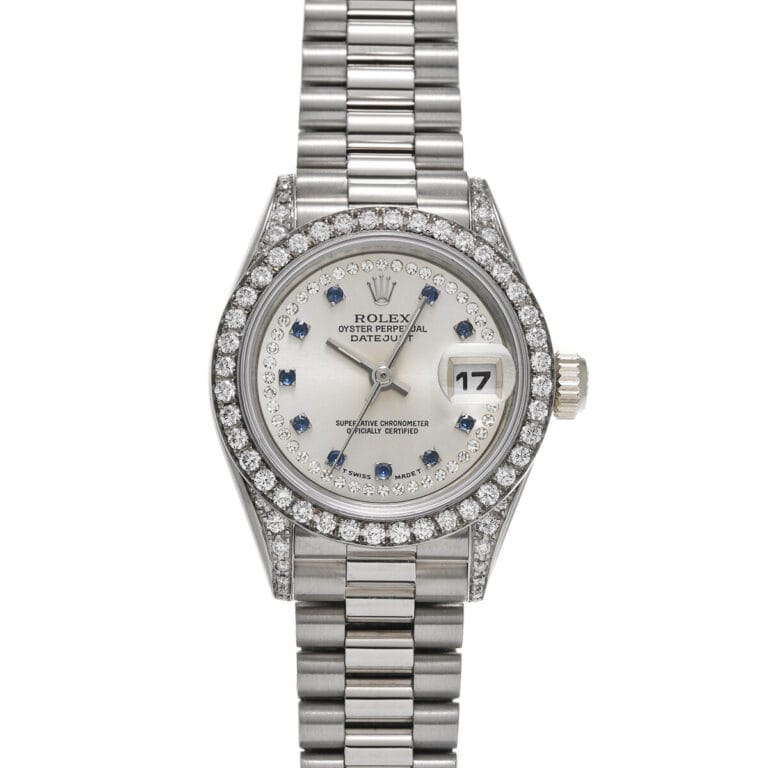 A silver Rolex Datejust luxury watch featuring a diamond bezel, sapphire markers, and a stainless steel bracelet, this stunning Rolex 69159 exudes timeless elegance.