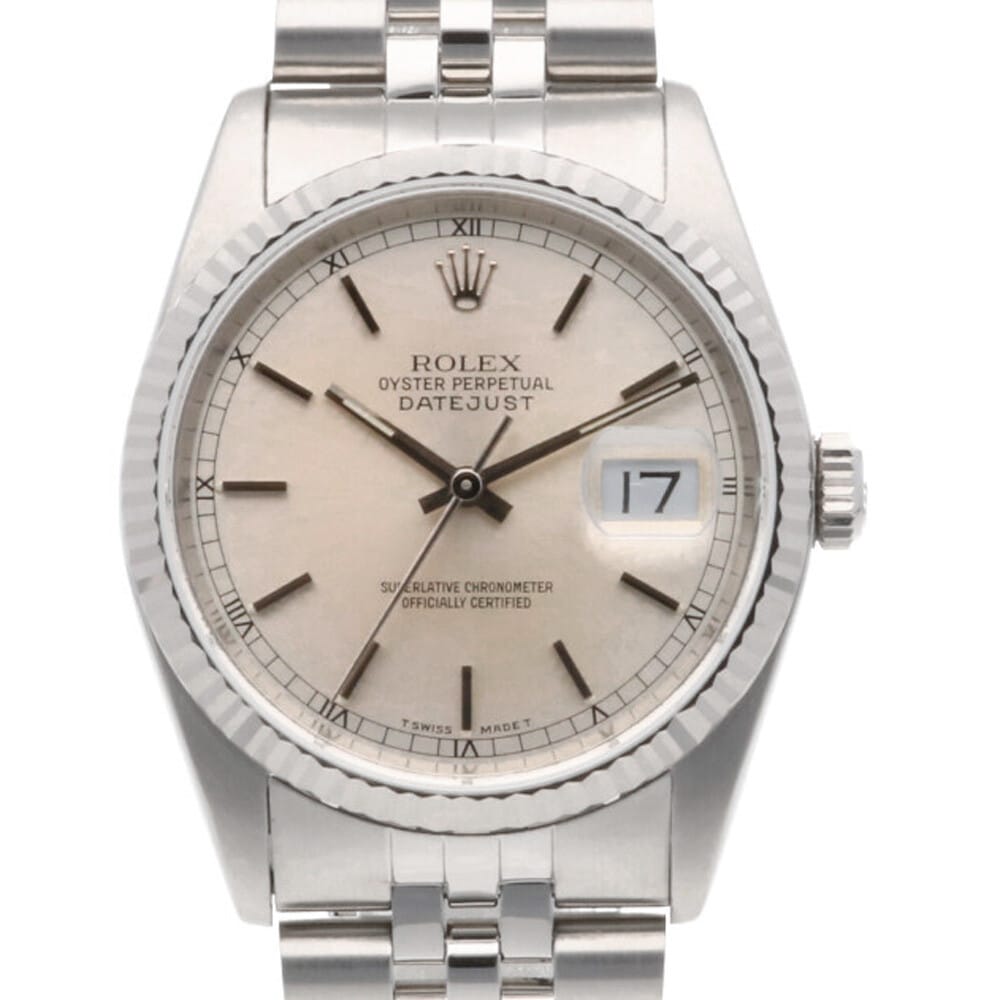 Silver Rolex Datejust watch with Roman numeral markers and a date window showing the 17th, exuding timeless elegance.