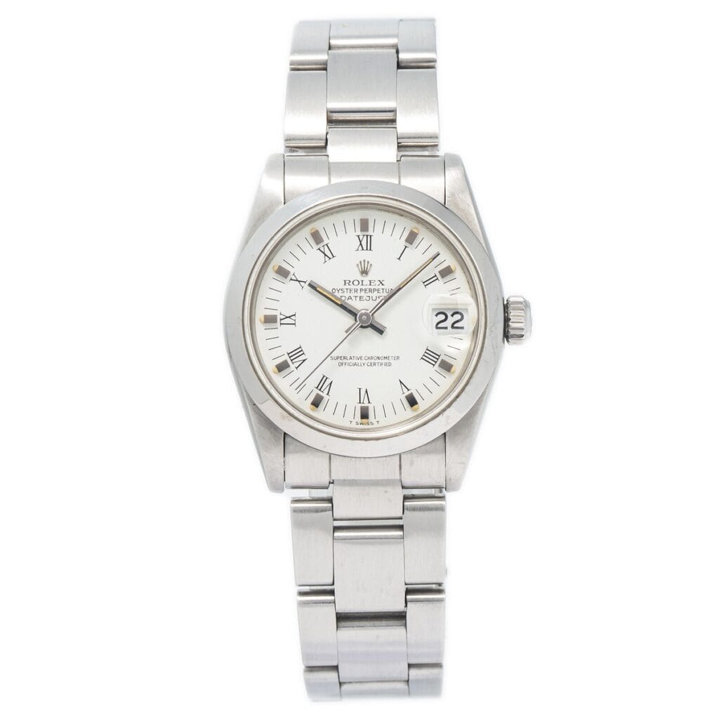 Silver Rolex Datejust 68240 wristwatch with a white face, Roman numerals, and a date window at the 3 o’clock position.