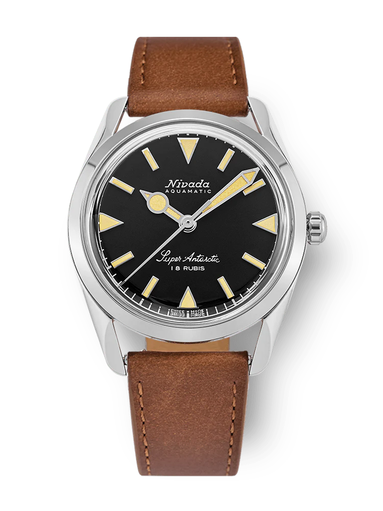 A Nivada Grenchen Super Antarctic wristwatch with a black dial, silver case, and brown leather strap, model 35013M16.