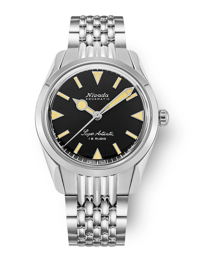 A silver Nivada Grenchen Super Antarctic wristwatch, model 35013M04, featuring a black dial, yellow hour markers, and a metal link bracelet.