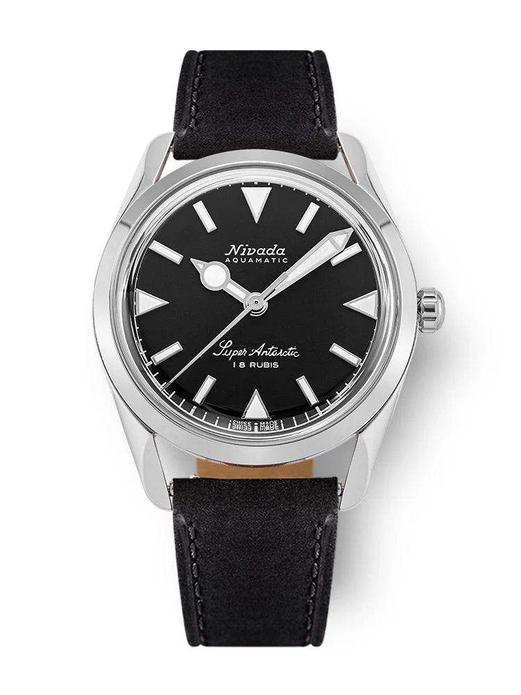 A silver Nivada Grenchen Super Antarctic wristwatch with a black dial, white markers, and a black leather strap.