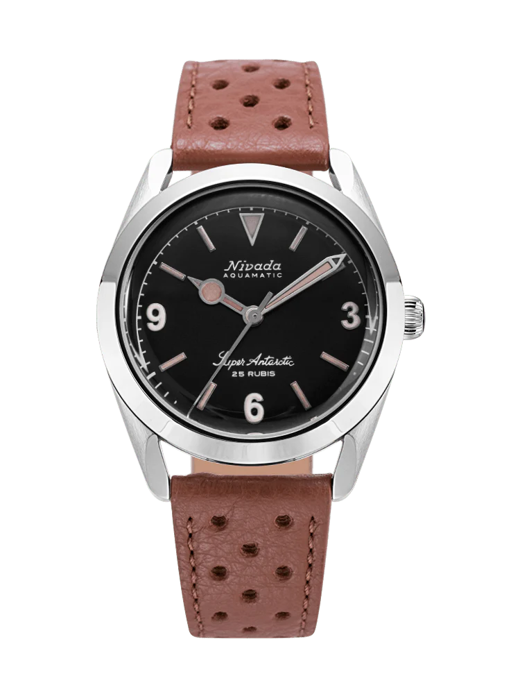 A Nivada Grenchen Super Antarctic wristwatch with a black dial, silver case, and brown perforated leather strap on a transparent background. Model: 32032A23.