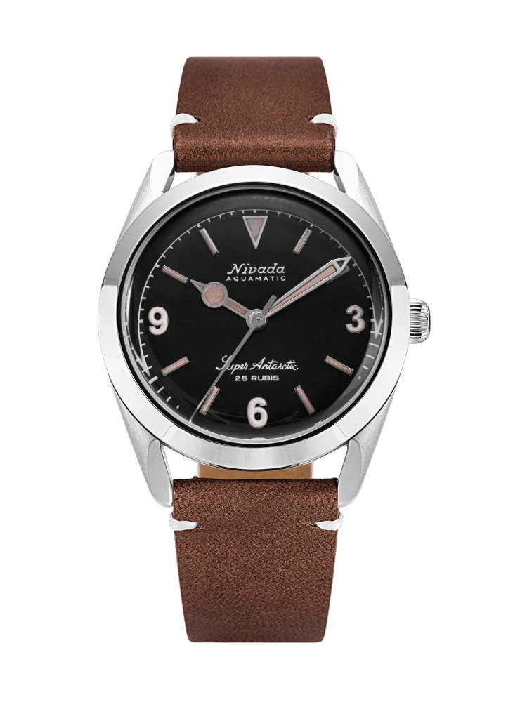 A classic Nivada Grenchen wristwatch with a brown leather strap and a black dial displaying silver hour markers and hands, inspired by the iconic Super Antarctic 32032A14 design.