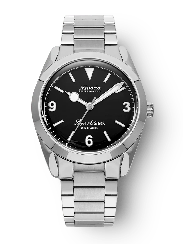 A silver Nivada Grenchen Super Antarctic automatic wristwatch with a black dial and metal link bracelet, displaying the time 10:09. Model 32039A20.