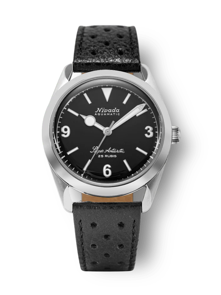 A black Nivada Grenchen Super Antarctic wristwatch, model 32039A10, with a leather strap and silver casing, showing 10:09 on the dial.