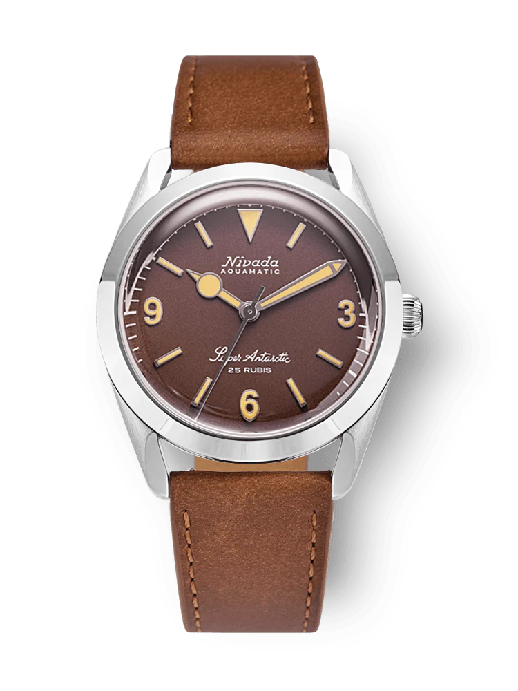 A Nivada Grenchen Super Antarctic wristwatch with a brown dial, brown leather strap, and silver case, showing the time 3:53. Model: 32041A16.