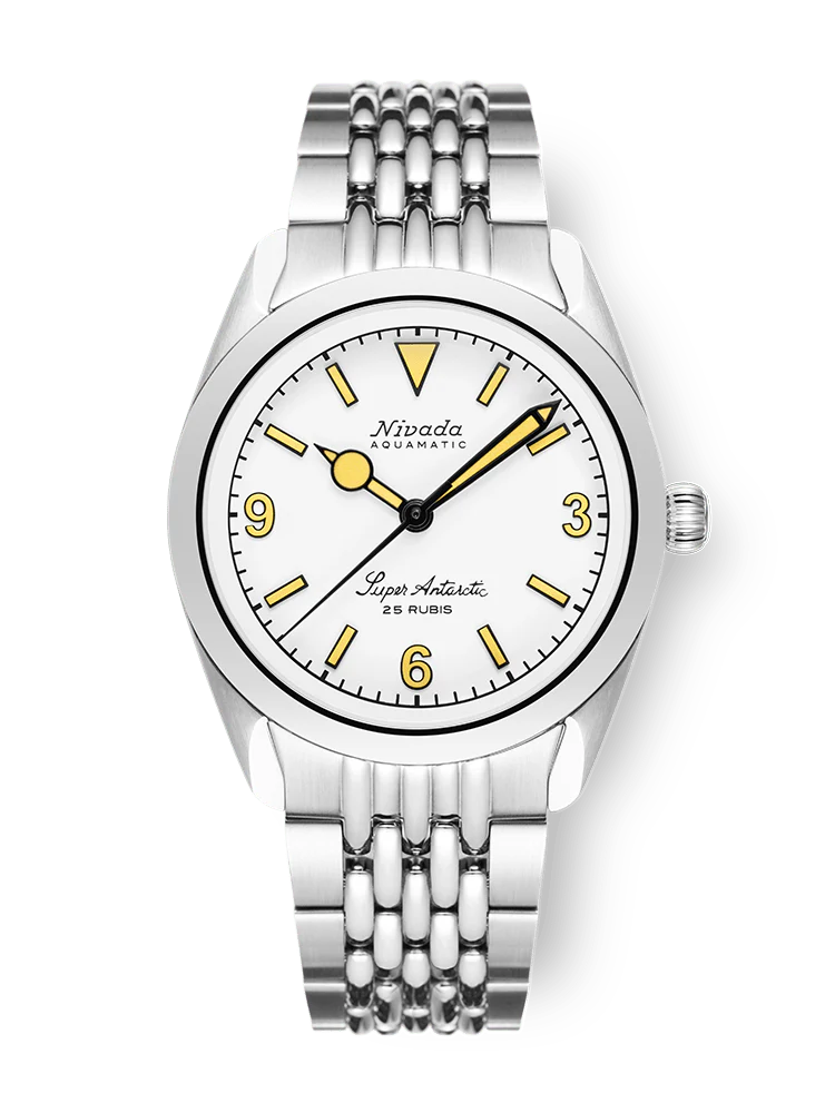 A silver Nivada Grenchen Super Antarctic automatic wristwatch with a white dial, yellow hour markers, and a metal link band. Model: 32066A04.