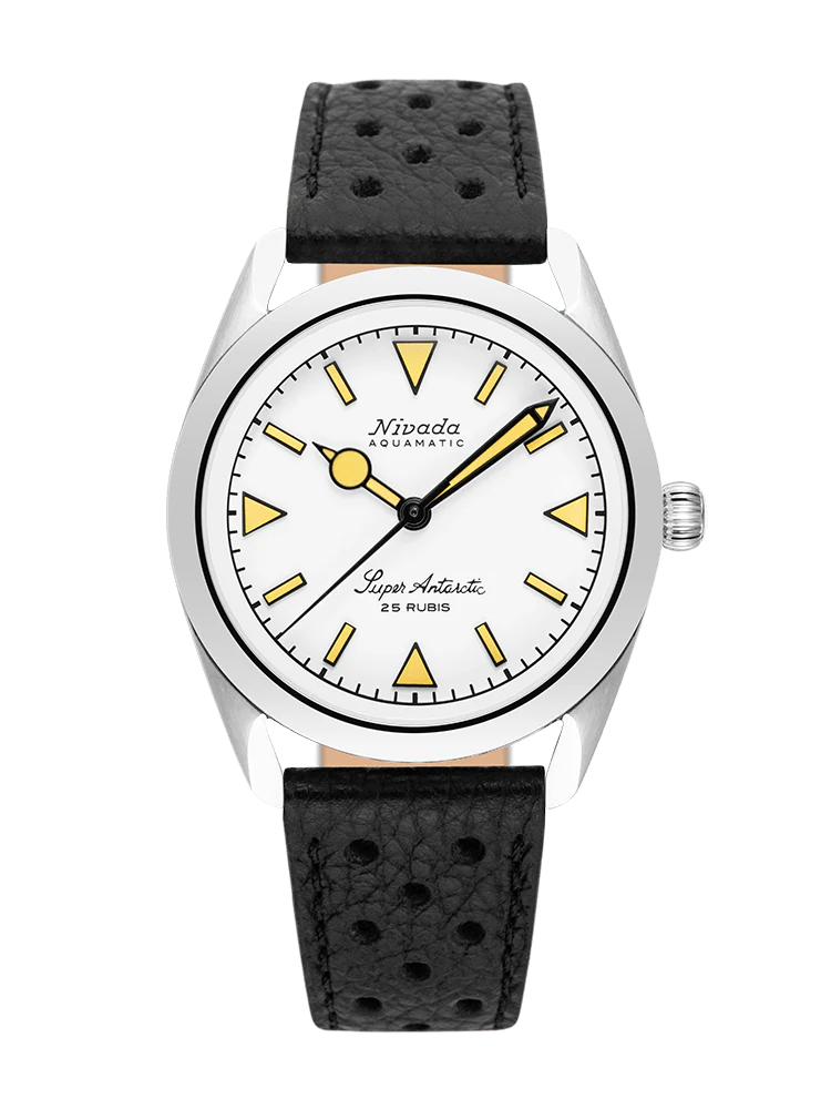 A Nivada Grenchen Super Antarctic automatic wristwatch with a white dial, yellow accents, and a black perforated leather strap.