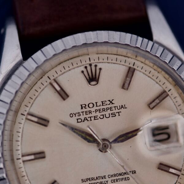 Close-up of a Rolex Datejust 1603 Silver Dial Alpha hands, showcasing its elegant silver dial and iconic date magnifier.